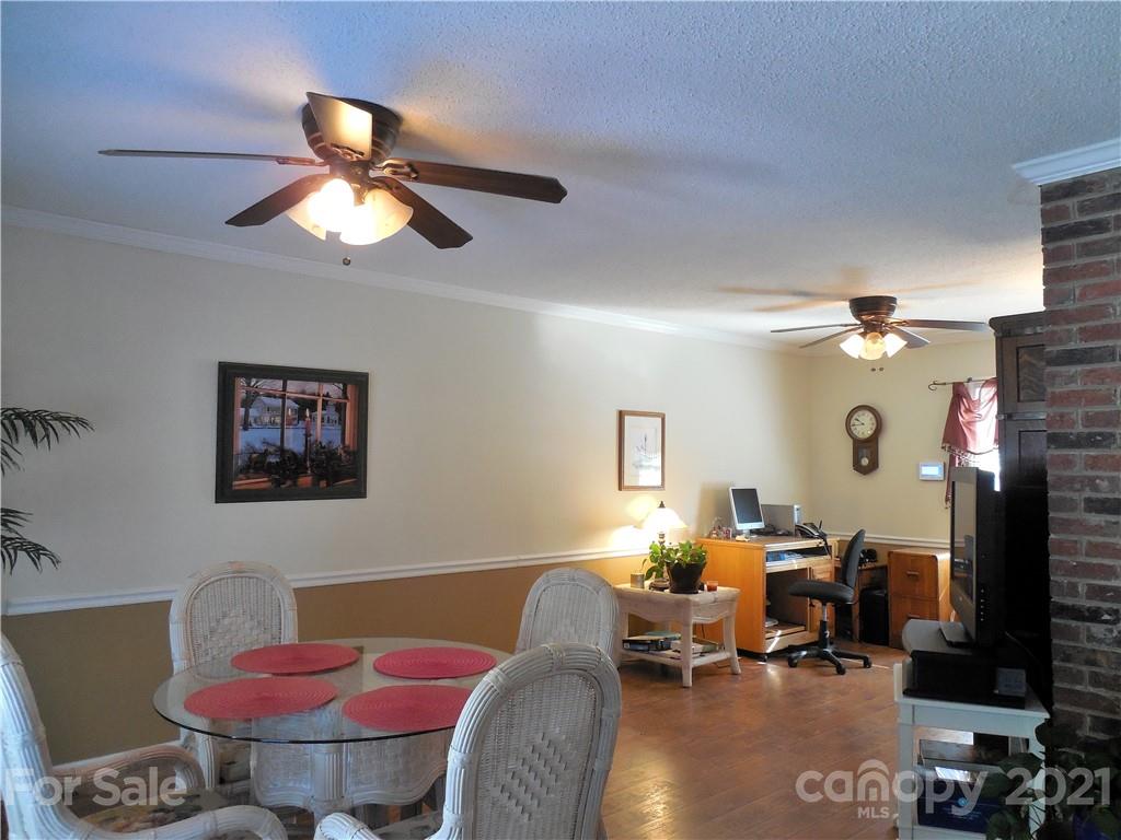 705 Washington Lane Kannapolis, NC 28083 - Photo 14 of 31 a view of a livingroom with furniture and a potted plant