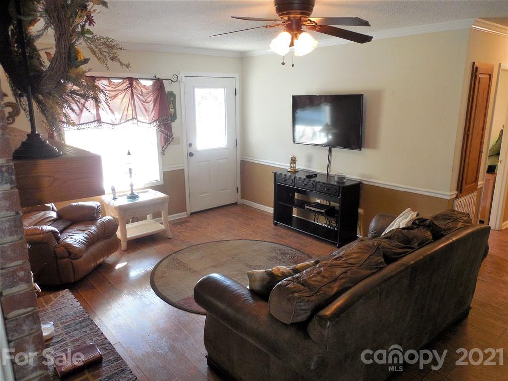 705 Washington Lane Kannapolis, NC 28083 - Photo 16 of 31 a living room with furniture and a flat screen tv