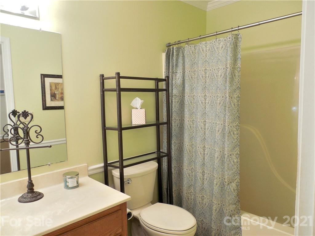 705 Washington Lane Kannapolis, NC 28083 - Photo 19 of 31 a bathroom with a sink a toilet and shower