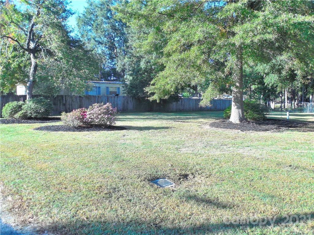 705 Washington Lane Kannapolis, NC 28083 - Photo 3 of 31 a garden with lots of trees