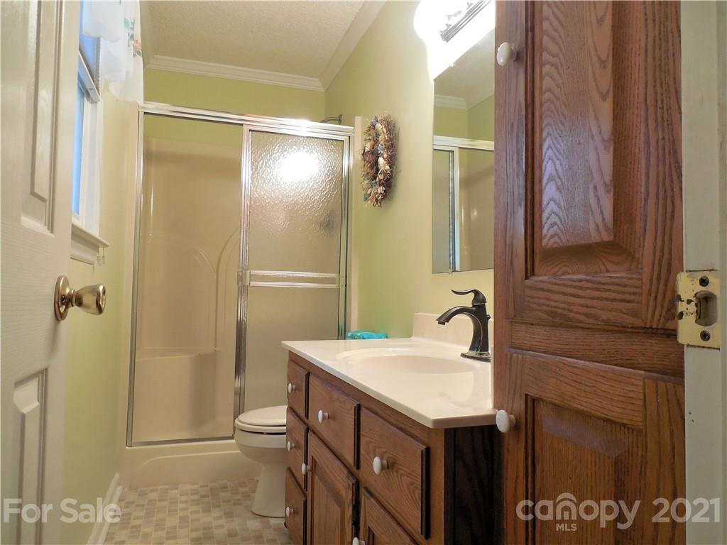 705 Washington Lane Kannapolis, NC 28083 - Photo 24 of 31 a bathroom with a sink and mirror