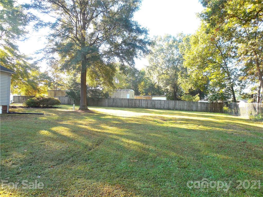 705 Washington Lane Kannapolis, NC 28083 - Photo 27 of 31 a view of yard with swimming pool and trees