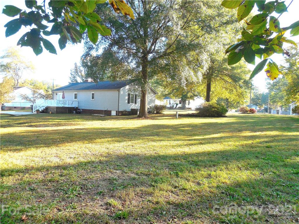 705 Washington Lane Kannapolis, NC 28083 - Photo 28 of 31 a view of a swimming pool with an outdoor space and seating area