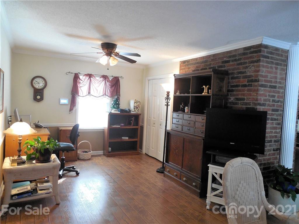 705 Washington Lane Kannapolis, NC 28083 - Photo 10 of 31 a living room with furniture and wooden floor