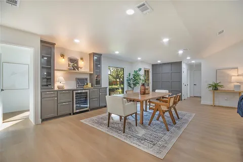 a large kitchen with a table and chairs