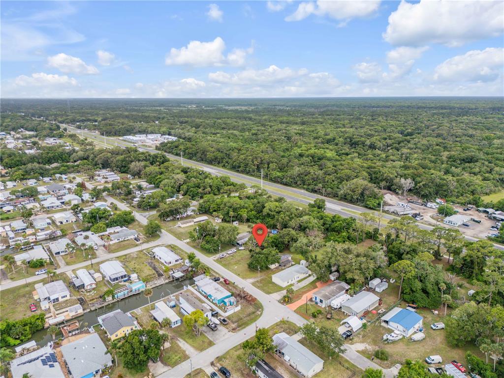 Nellie Street Edgewater, FL 32141 - Photo 11 of 27 an aerial view of residential houses with outdoor space
