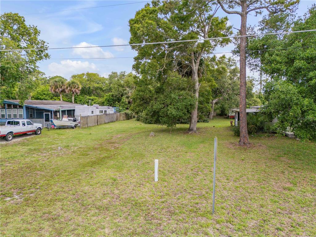 Nellie Street Edgewater, FL 32141 - Photo 24 of 27 a view of a house with a yard