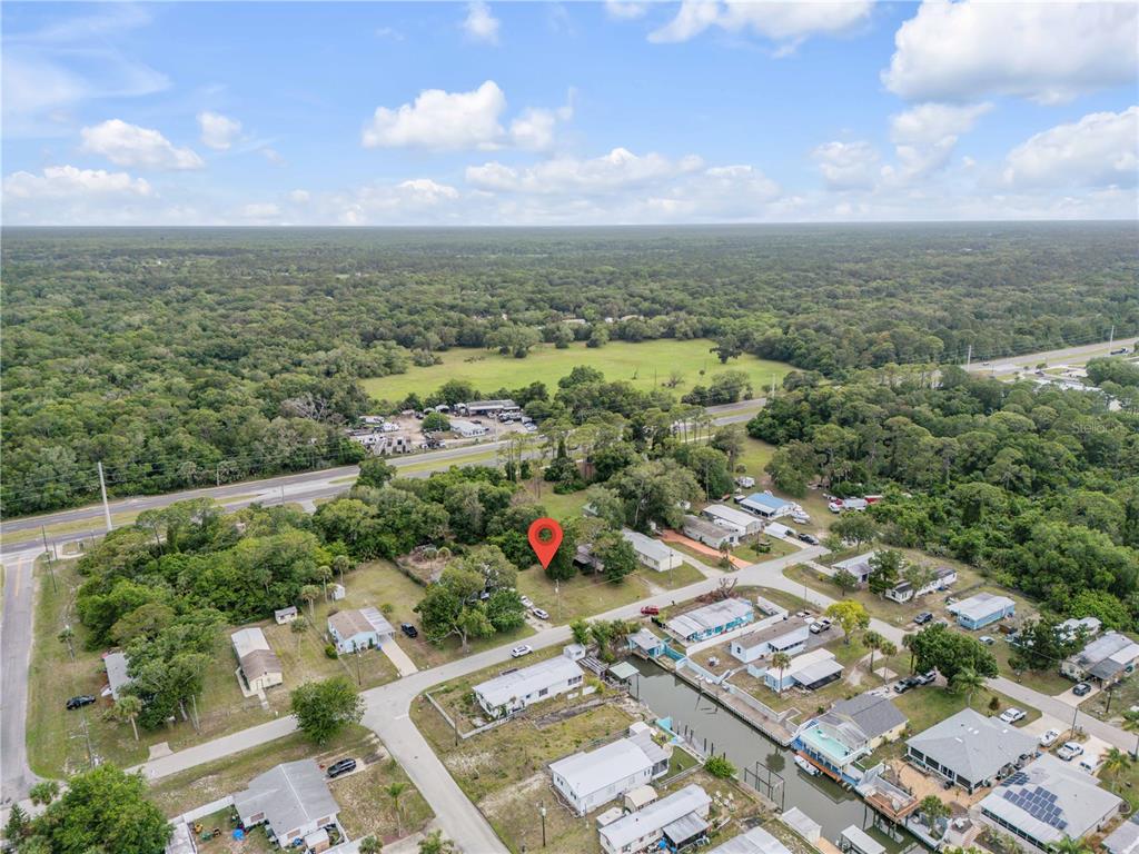 Nellie Street Edgewater, FL 32141 - Photo 4 of 27 an aerial view of residential houses with outdoor space and trees