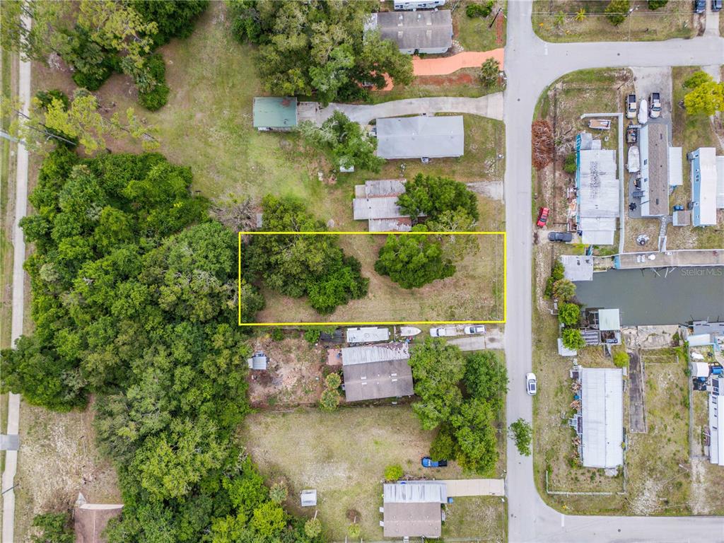 Nellie Street Edgewater, FL 32141 - Photo 5 of 27 an aerial view of a house with a yard basket ball court and outdoor seating