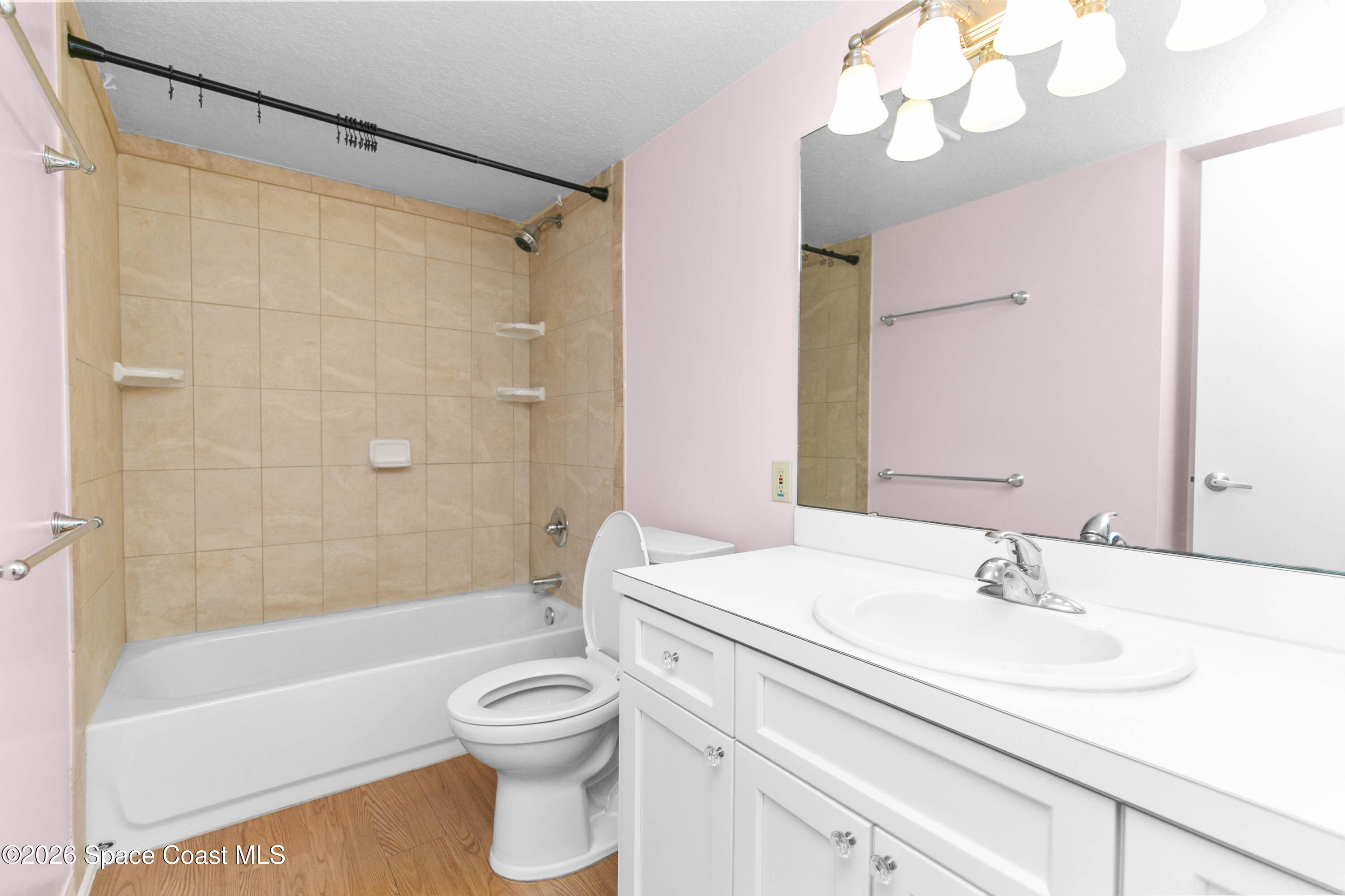 1410 Huntington Lane, Unit 1106 Rockledge, FL 32955 - Photo 12 of 23 a bathroom with a sink a toilet and a bathtub