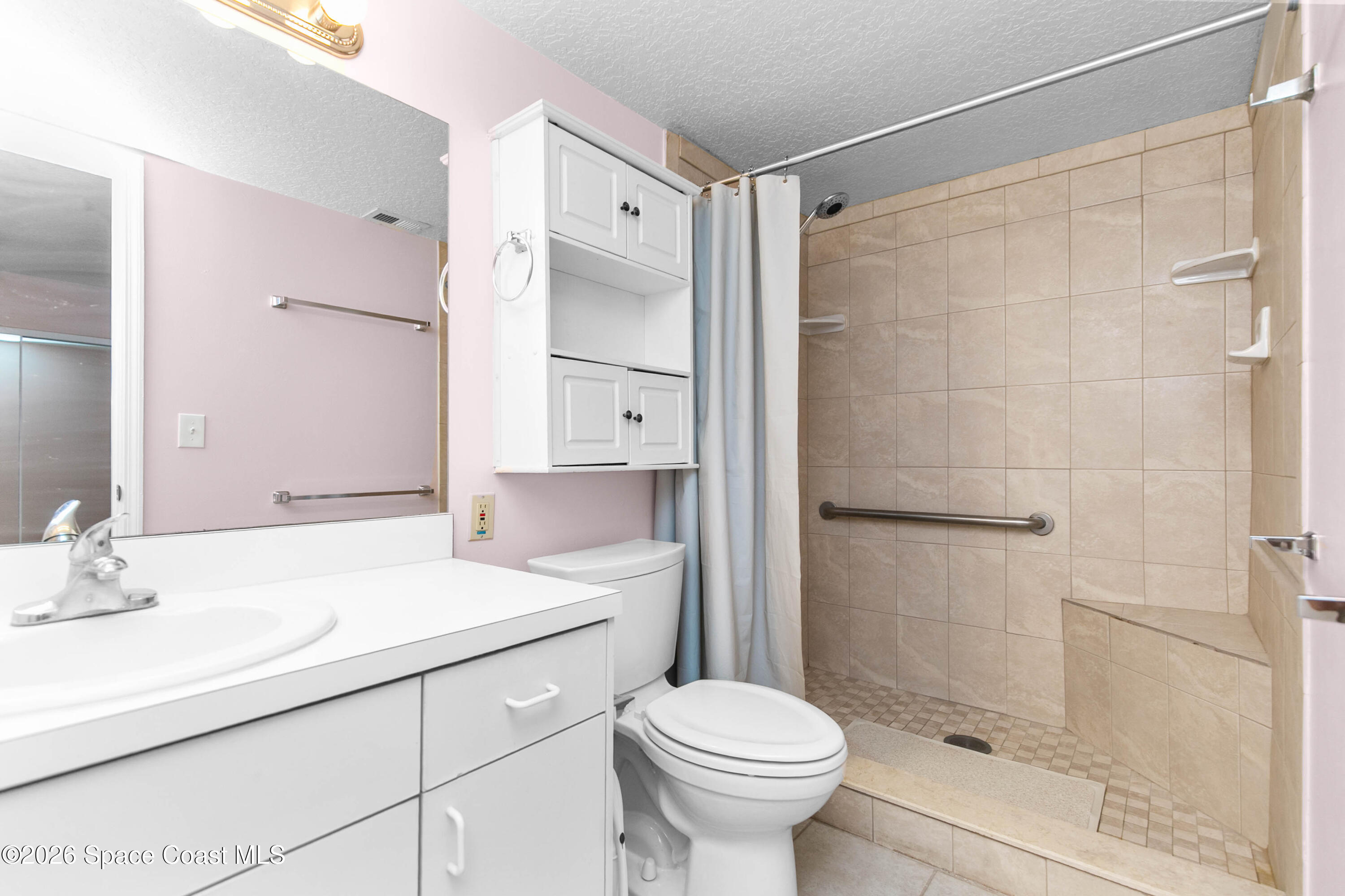 1410 Huntington Lane, Unit 1106 Rockledge, FL 32955 - Photo 15 of 23 a bathroom with a sink toilet and shower