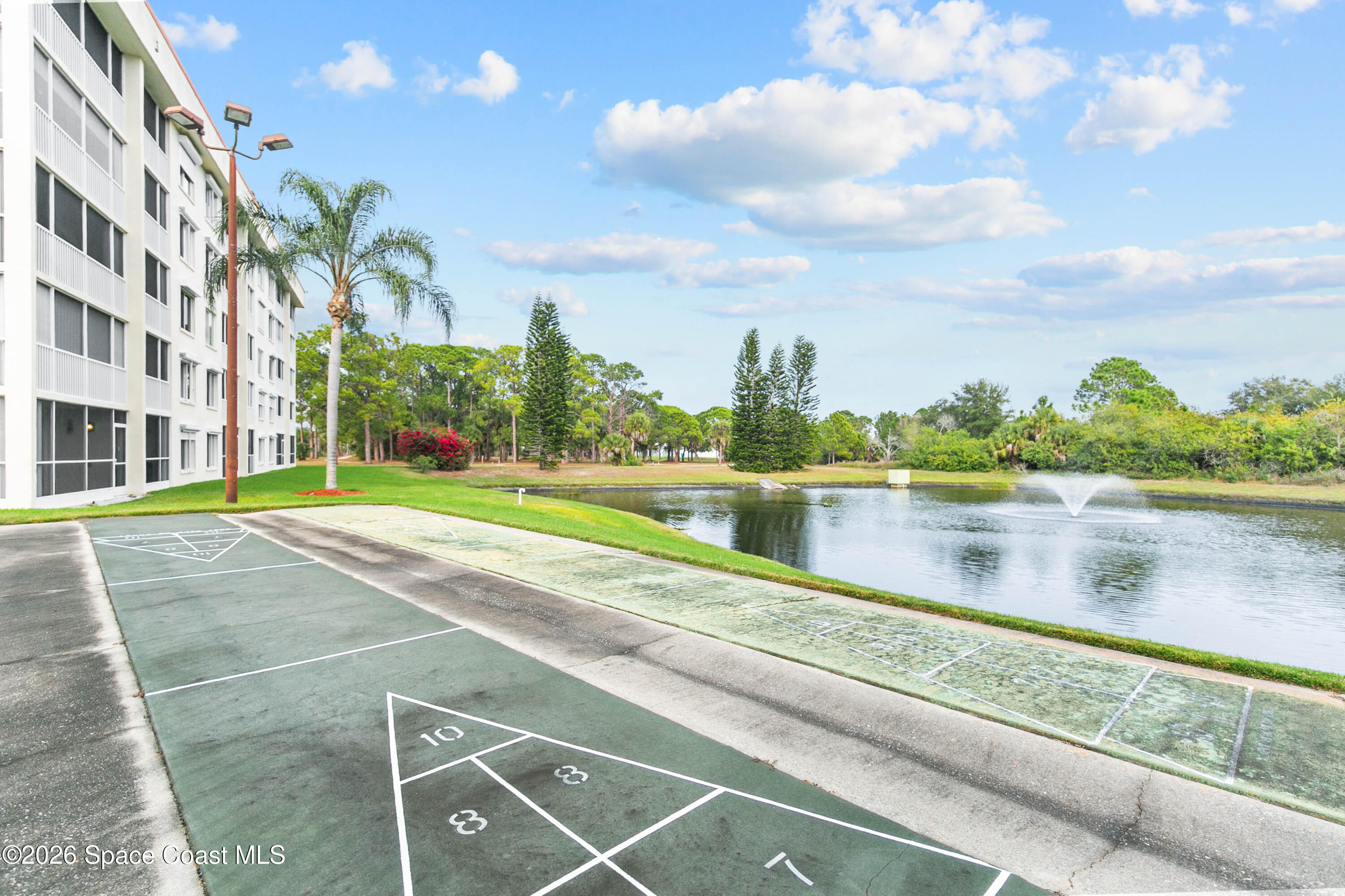 1410 Huntington Lane, Unit 1106 Rockledge, FL 32955 - Photo 22 of 23 a view of lake