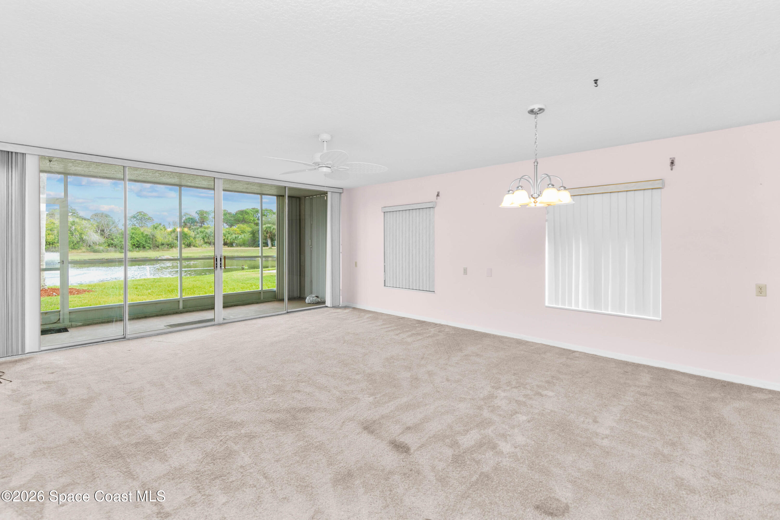 1410 Huntington Lane, Unit 1106 Rockledge, FL 32955 - Photo 7 of 23 a view of an empty room with a window