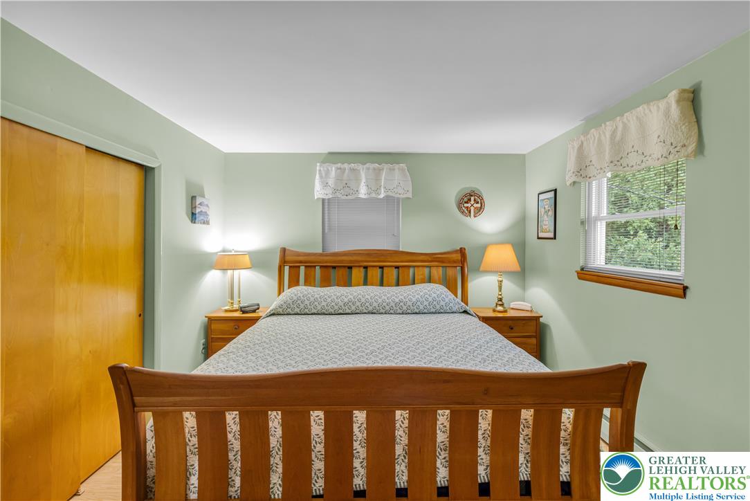 2750 Belaire Road Bethlehem, PA 18017 - Photo 25 of 56 Hardwood floors and natural light from multiple windows define this cozy bedroom.
