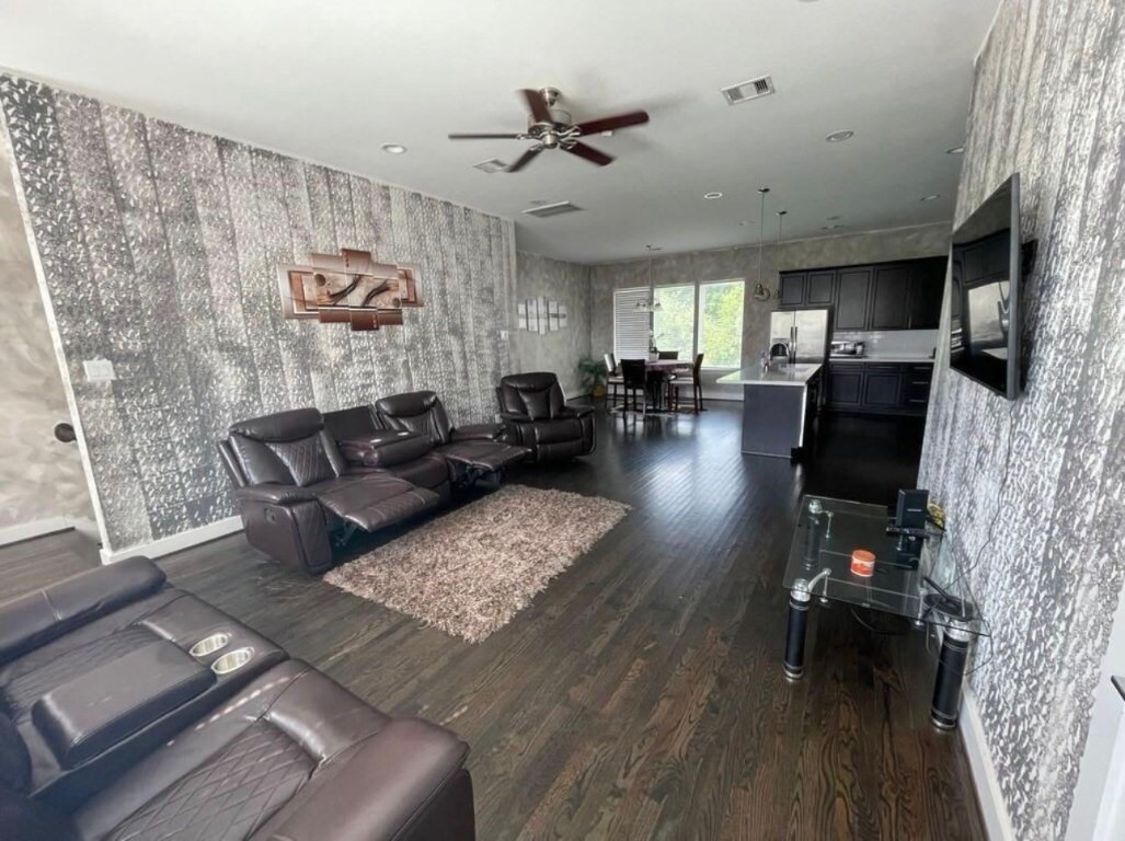2107 Stuart Street Houston, TX 77004 - Photo 14 of 30 a living room with furniture and wooden floor