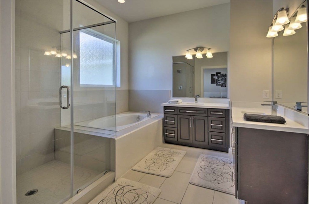 2107 Stuart Street Houston, TX 77004 - Photo 19 of 30 a bathroom with a tub sink and mirror