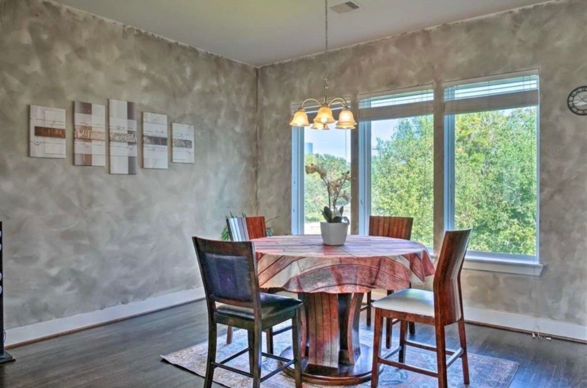 2107 Stuart Street Houston, TX 77004 - Photo 7 of 30 a view of a dining room with furniture window and wooden floor
