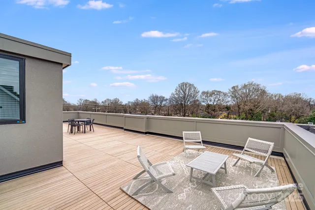 a view of a room with a white walls
