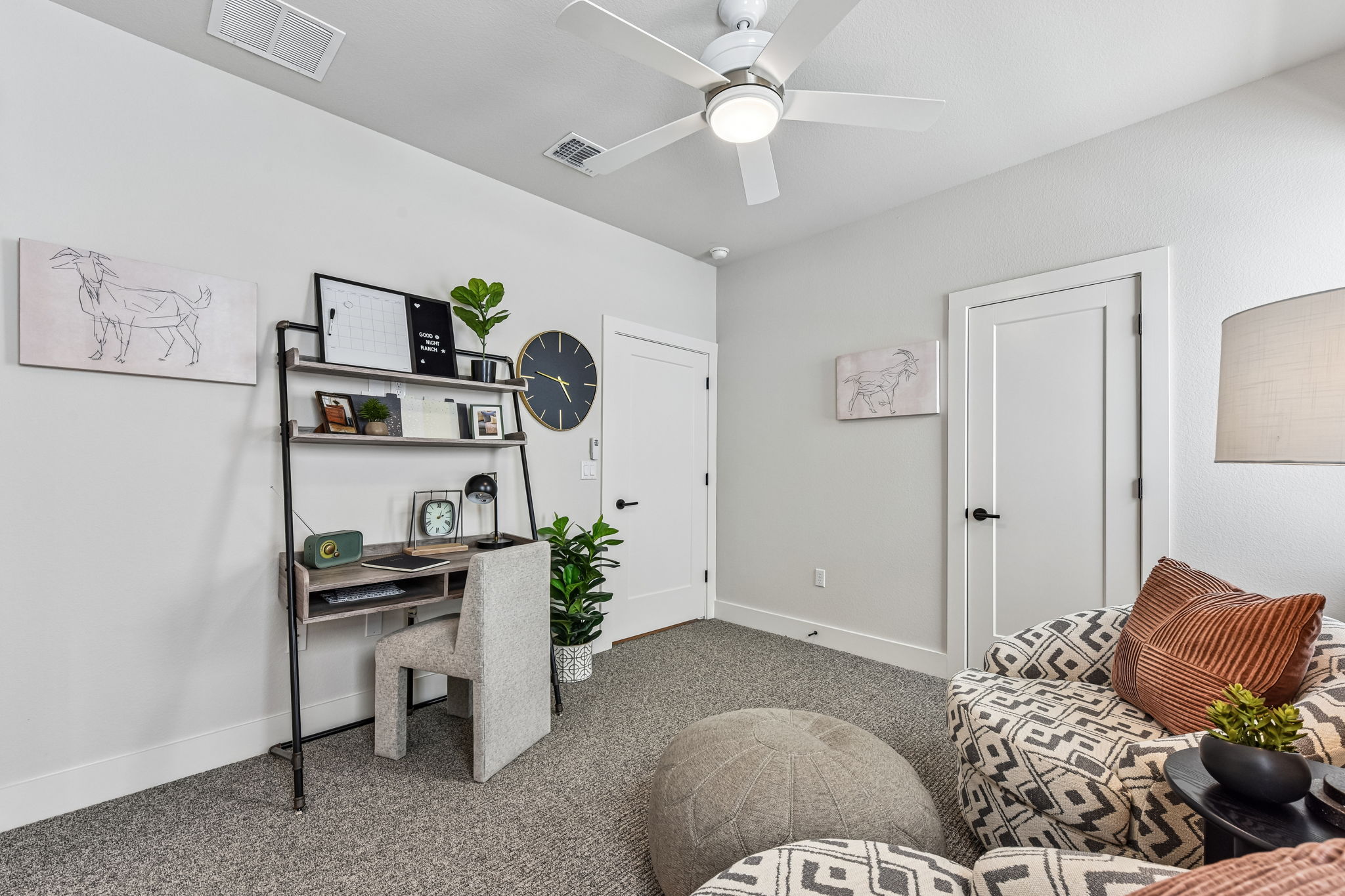 9033 Cattle Baron Path Austin, TX 78747 - Photo 21 of 40 Well-lit room provides a flexible space for work or leisure, illuminated by a ceiling fan.