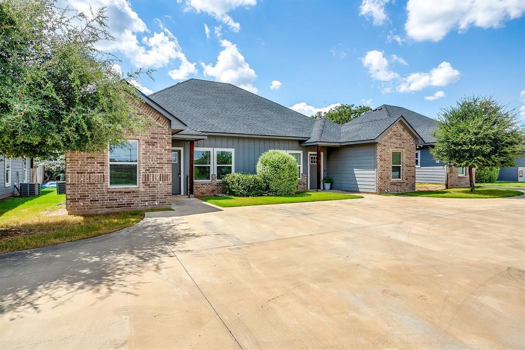 2706 James Road Granbury, TX 76049 - Photo 2 of 23 a view of a house with backyard and garden