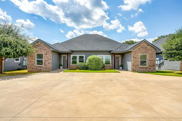 a view of a house with basketball court
