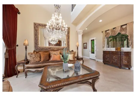 a kitchen with granite countertop a stove a sink and a refrigerator