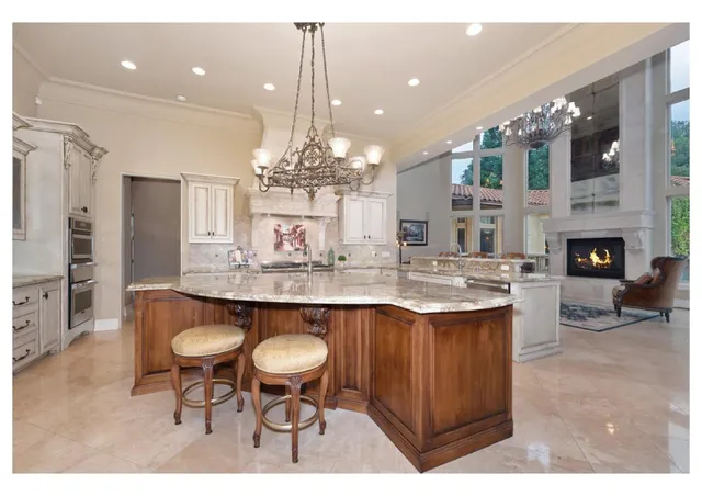 a living room with furniture fireplace and a table