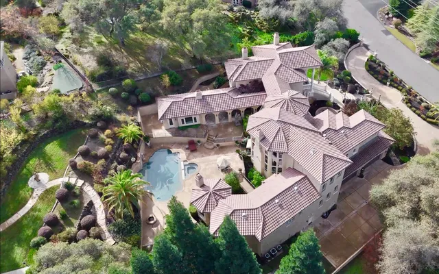 an aerial view of residential houses with outdoor space