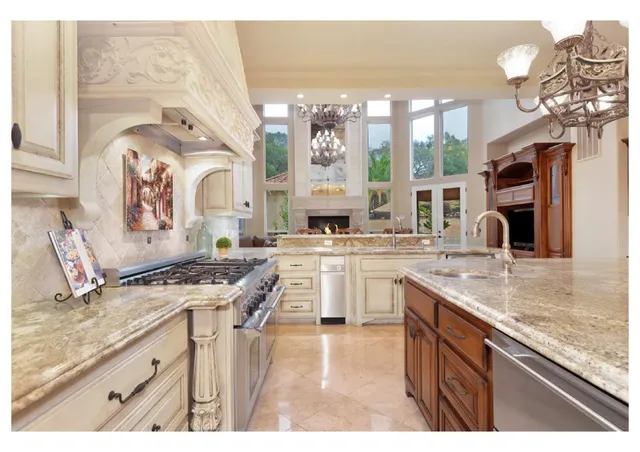 a living room with furniture a fireplace and a floor to ceiling window