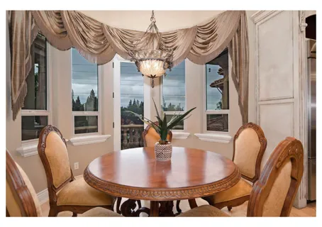 a bathroom with a granite countertop sink a large mirror and a