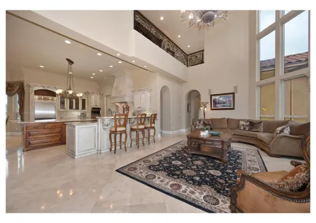 a view of spacious bathroom with a tub and mirror
