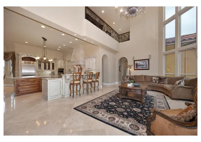 a view of spacious bathroom with a tub and mirror