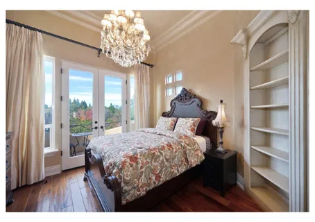 a view of a hallway with furniture and a chandelier