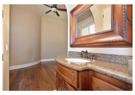 a view of a livingroom with furniture window and wooden floor