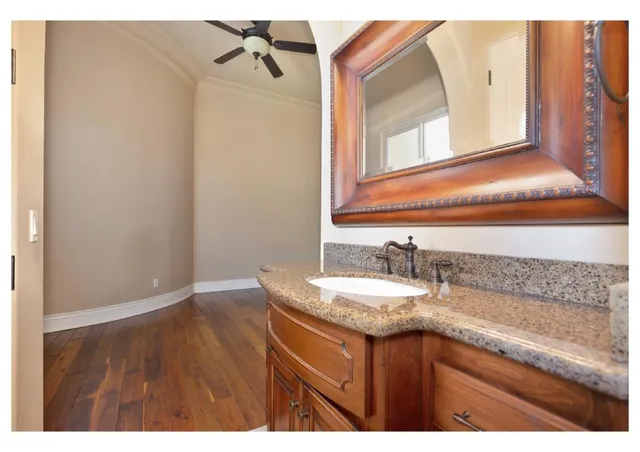 a view of a livingroom with furniture window and wooden floor