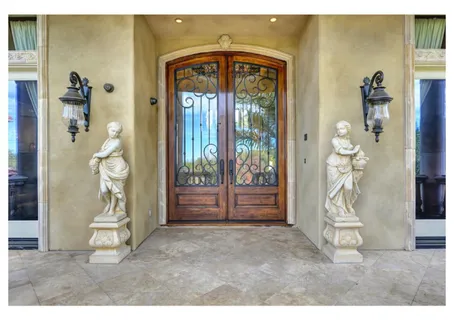 a view of a livingroom with furniture and a floor to ceiling window