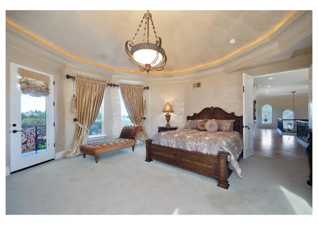 a bedroom with a bed and a fireplace