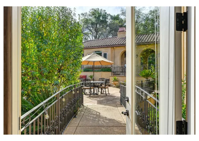 a view of a garden with a building in the background