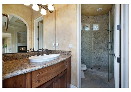 a view of a lake in middle of a field