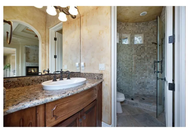 a view of a lake in middle of a field