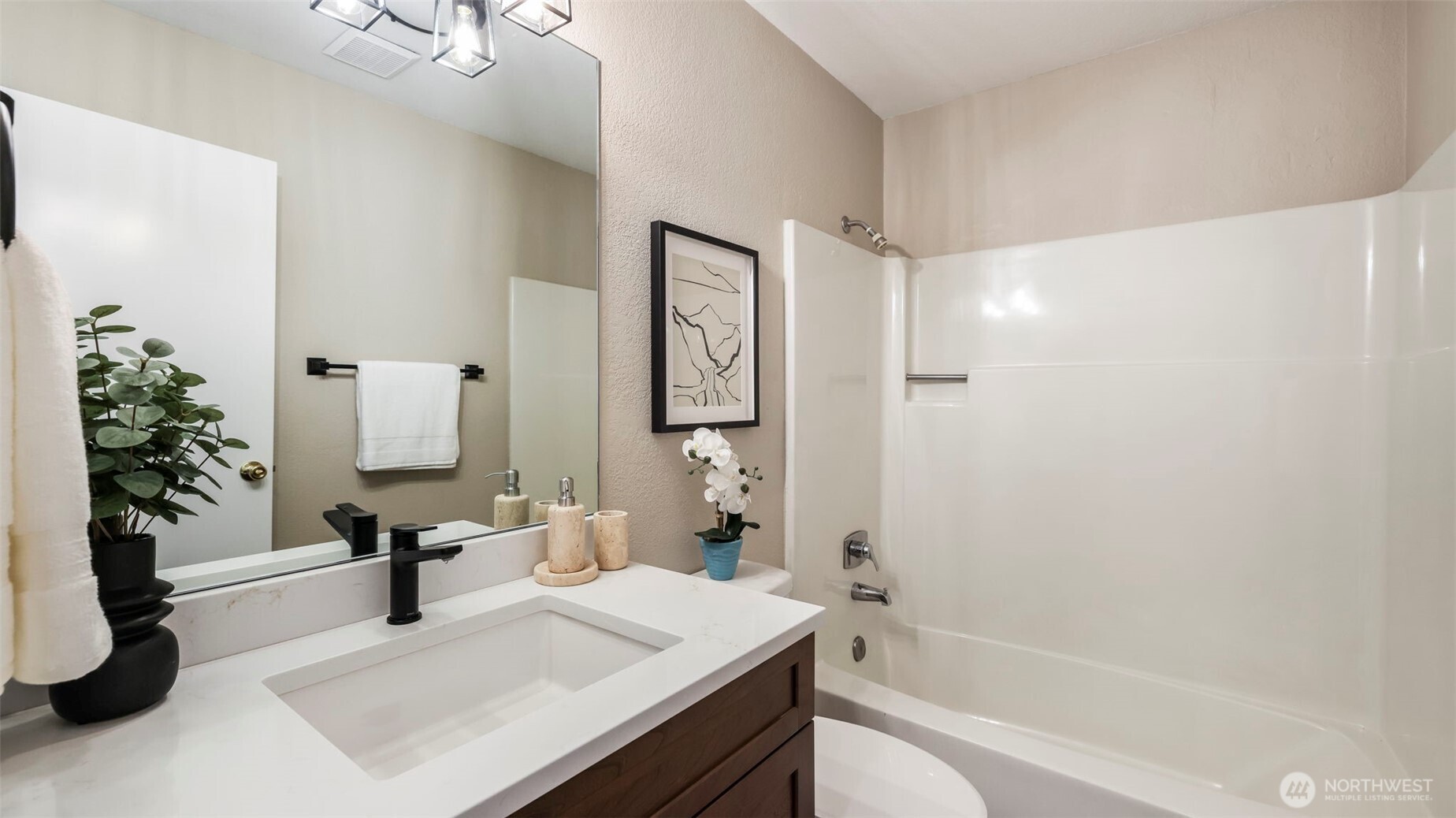 17606 Northeast 27th Street Redmond, WA 98052 - Photo 25 of 32 a bathroom with a tub sink and mirror
