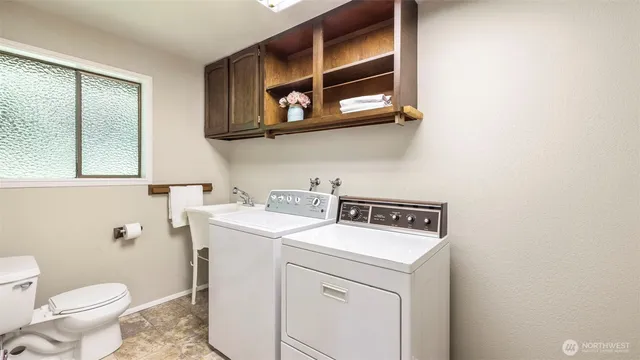 a utility room with dryer and washer