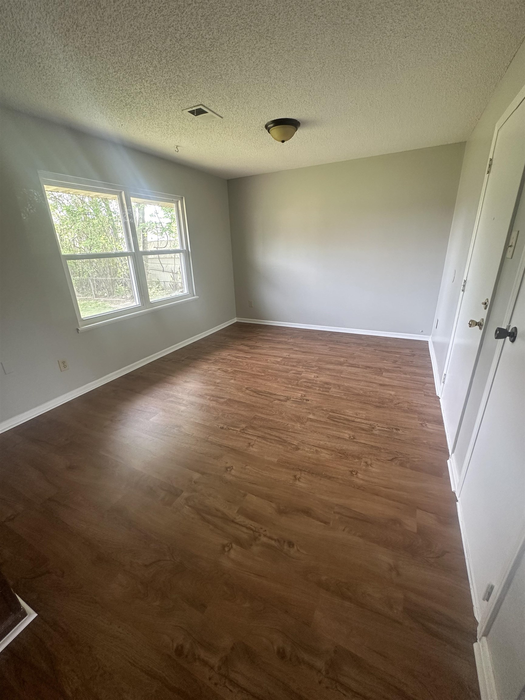 7882 Quito Road Millington, TN 38053 - Photo 3 of 9 an empty room with windows