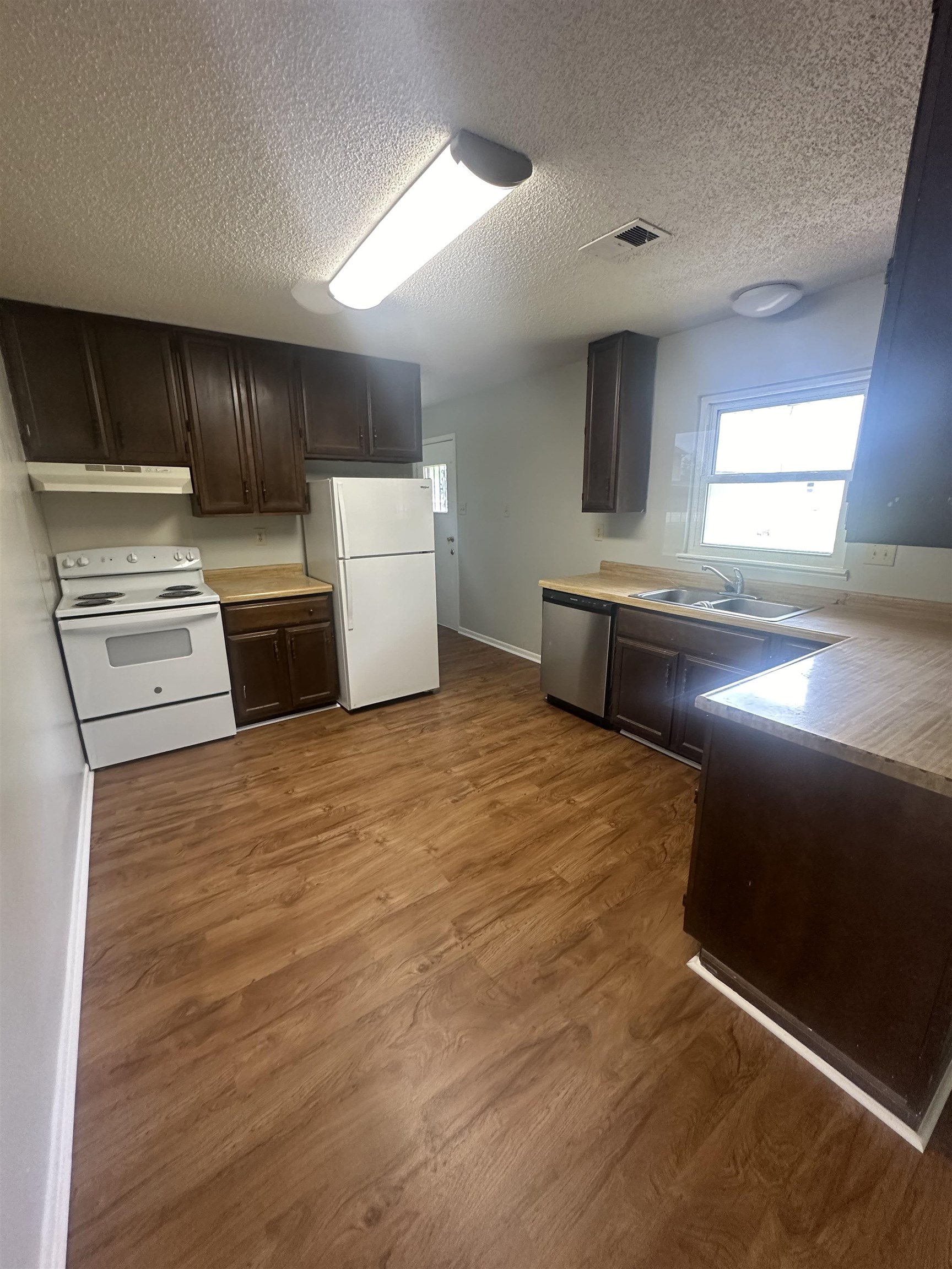7882 Quito Road Millington, TN 38053 - Photo 4 of 9 a kitchen with stainless steel appliances a refrigerator and a stove
