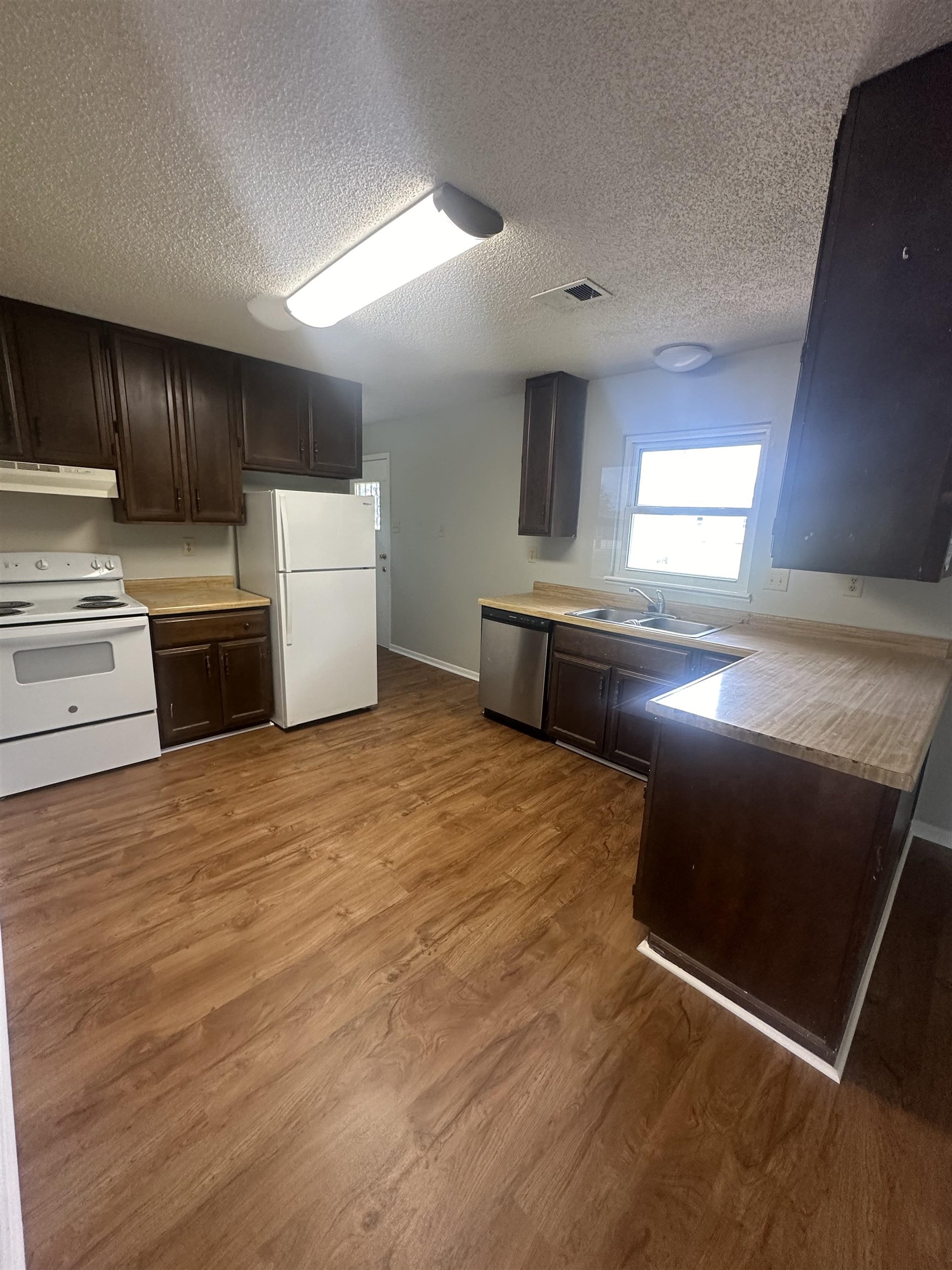 7882 Quito Road Millington, TN 38053 - Photo 5 of 9 a large kitchen with a stove and a refrigerator
