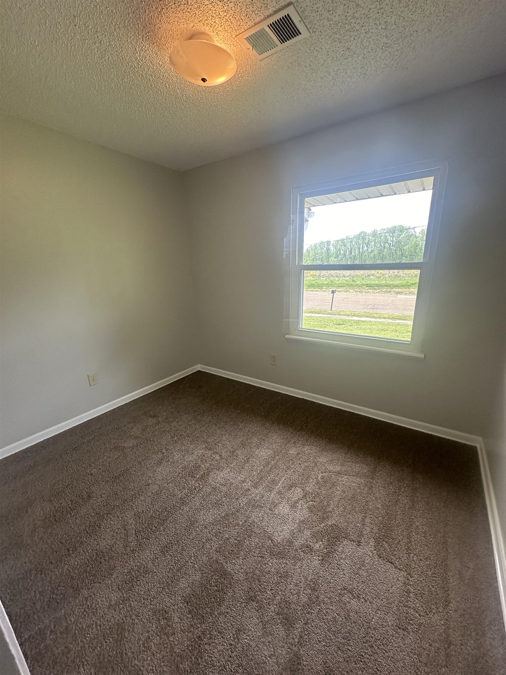 7882 Quito Road Millington, TN 38053 - Photo 7 of 9 an empty room with a window