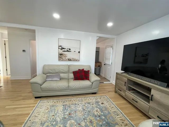 a kitchen with white cabinets stainless steel appliances and sink