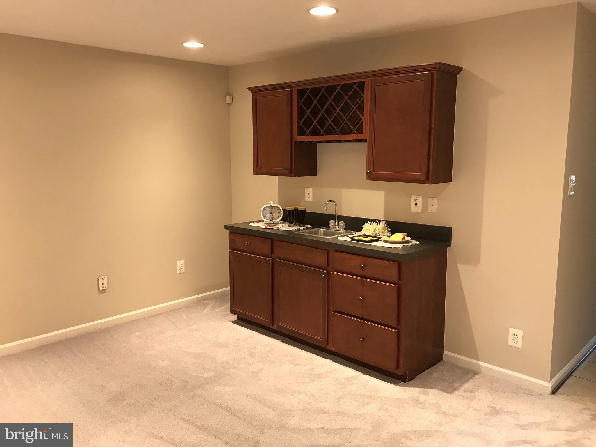 9884 Decatur Road Baltimore, MD 21220 - Photo 13 of 15 Lower Level Family Room with Butler Kitchen
