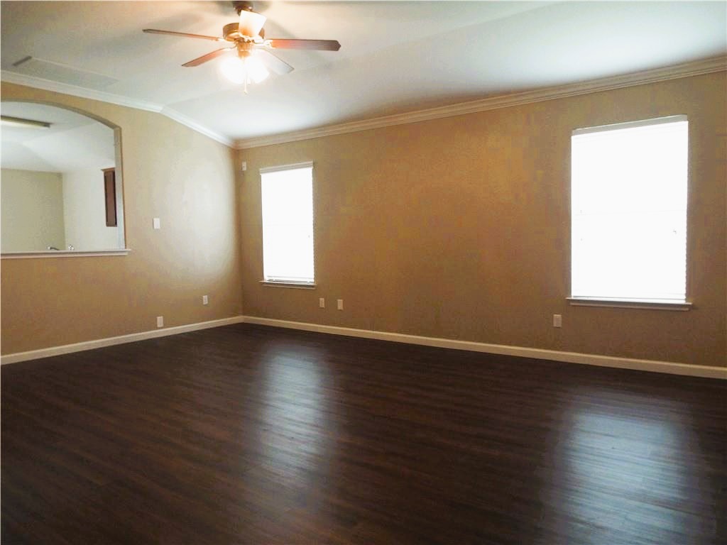 3609 Eagle Fledge Terrace Pflugerville, TX 78660 - Photo 2 of 15 Nice size family room, ceiling fan, and dark wood-style floors.