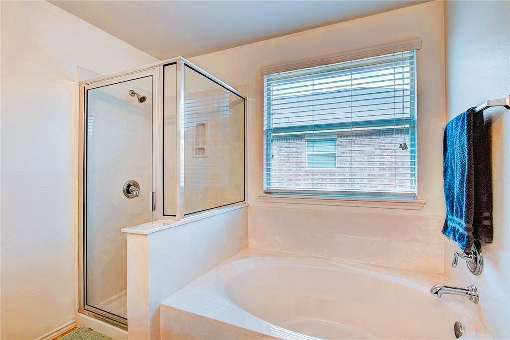 3609 Eagle Fledge Terrace Pflugerville, TX 78660 - Photo 9 of 15 Bathroom featuring a shower and a garden tub